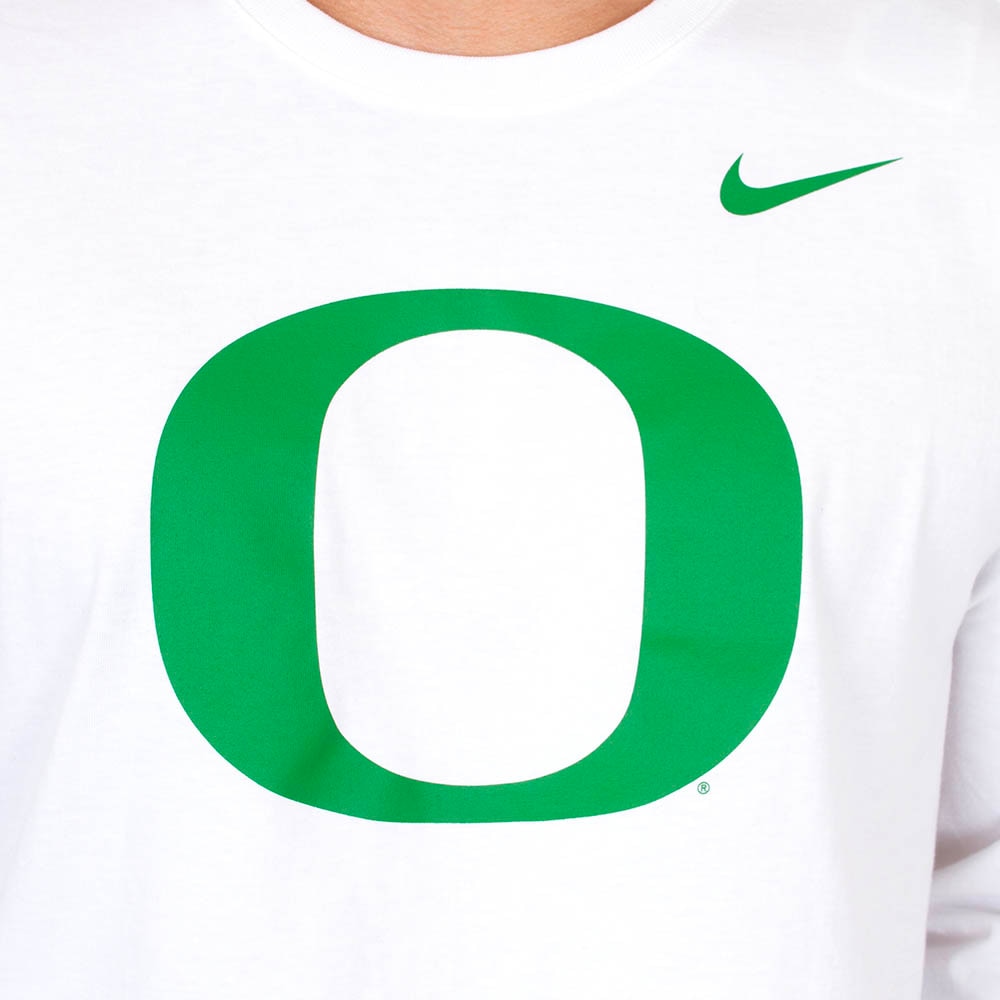 white nike shirt with green swoosh